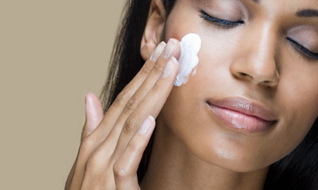 Woman using Skin lightening cream